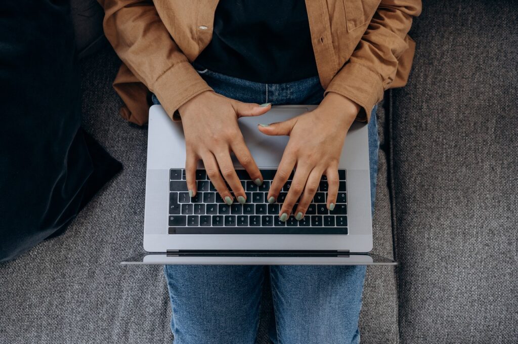 Woman typing on a laptop